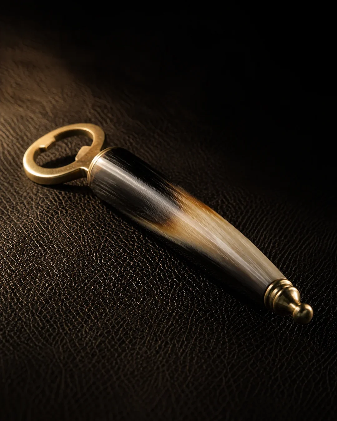Horn-handled bar opener on dark leather