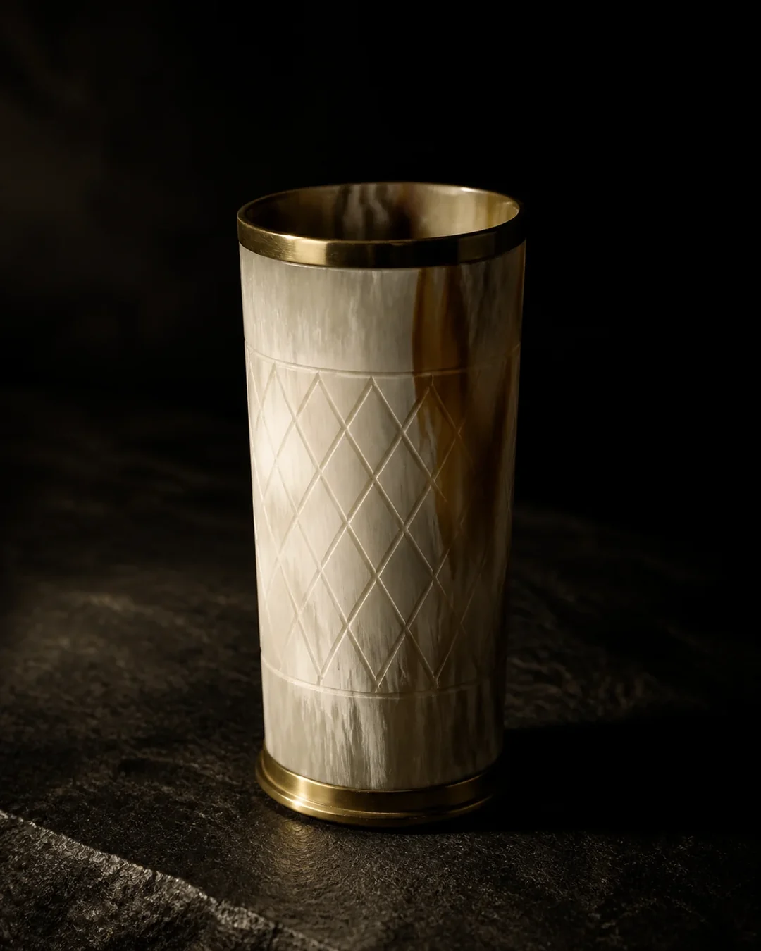 Pale horn glass with a brass rim